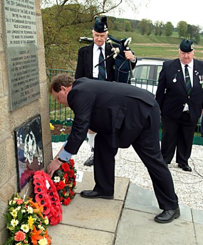 local mp d mundell lays a wreath at cameronian cairn during 2006 service